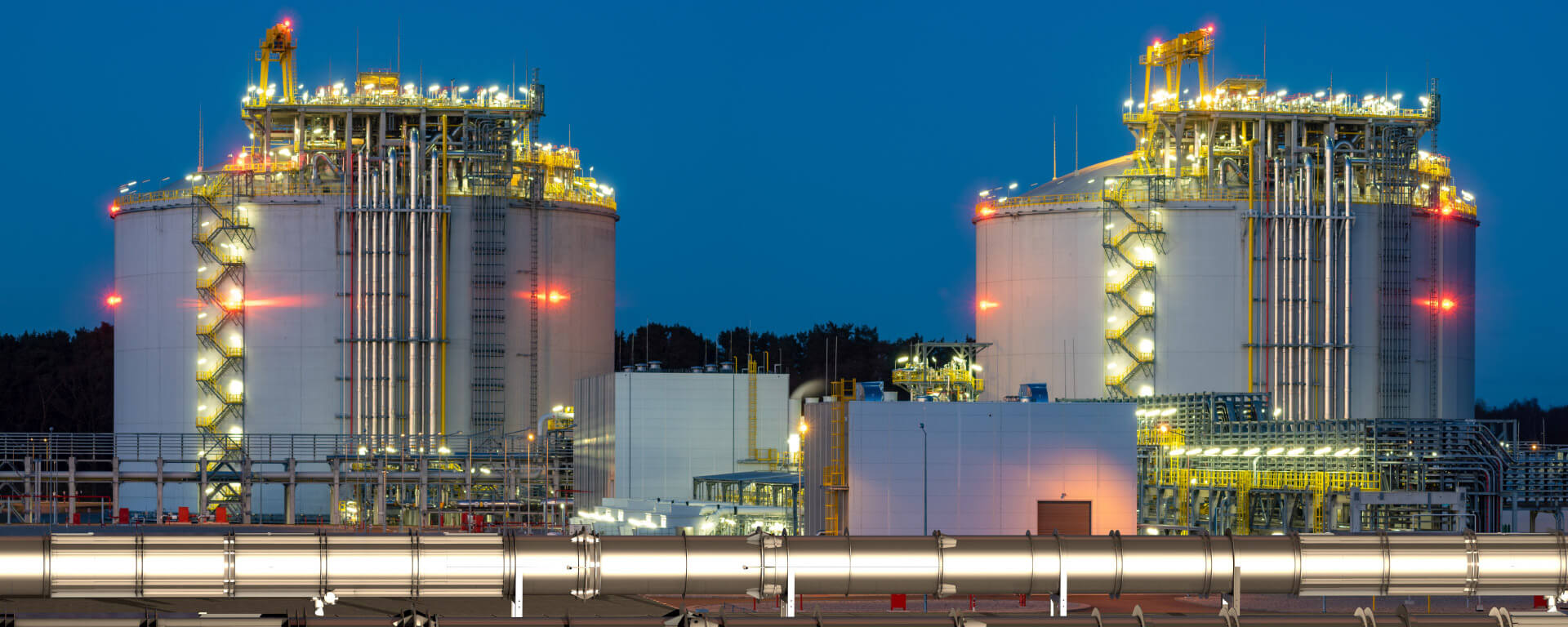 Illuminated industrial plant in the early hours of the morning