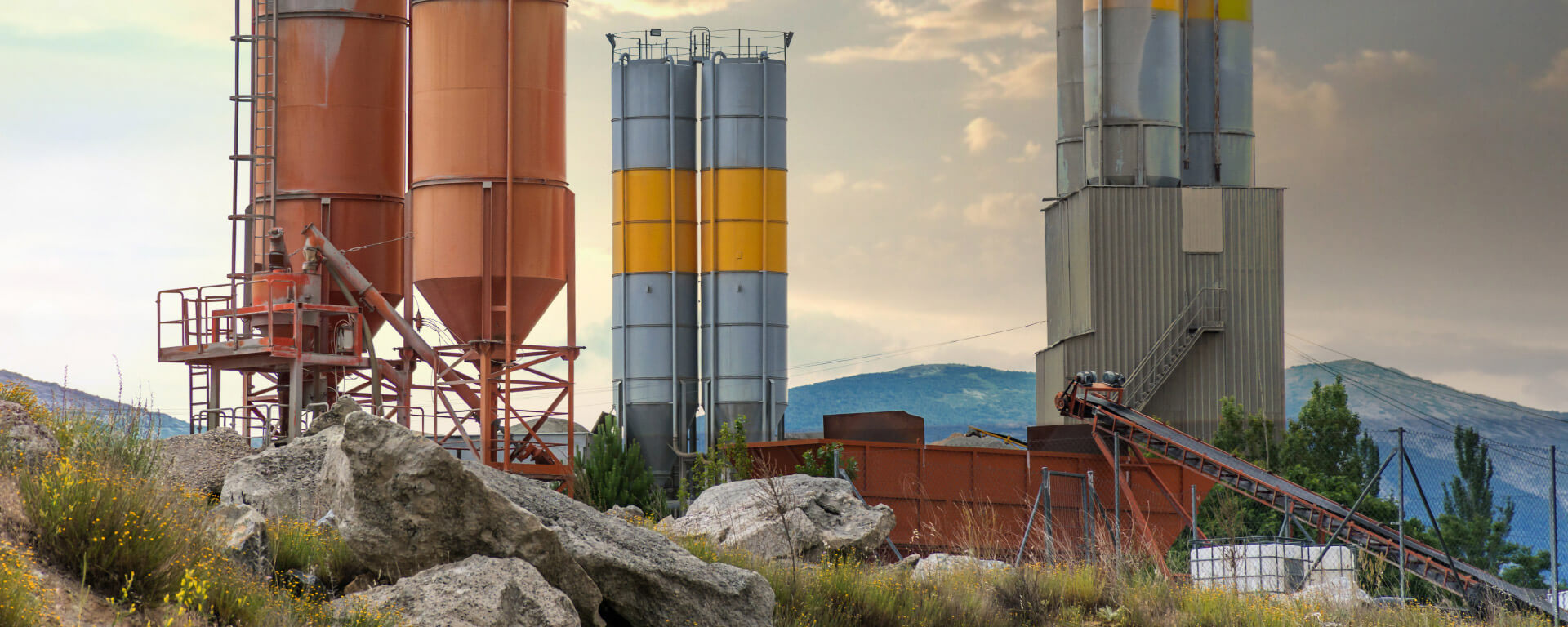 Various silos on a hill in a mountainous area