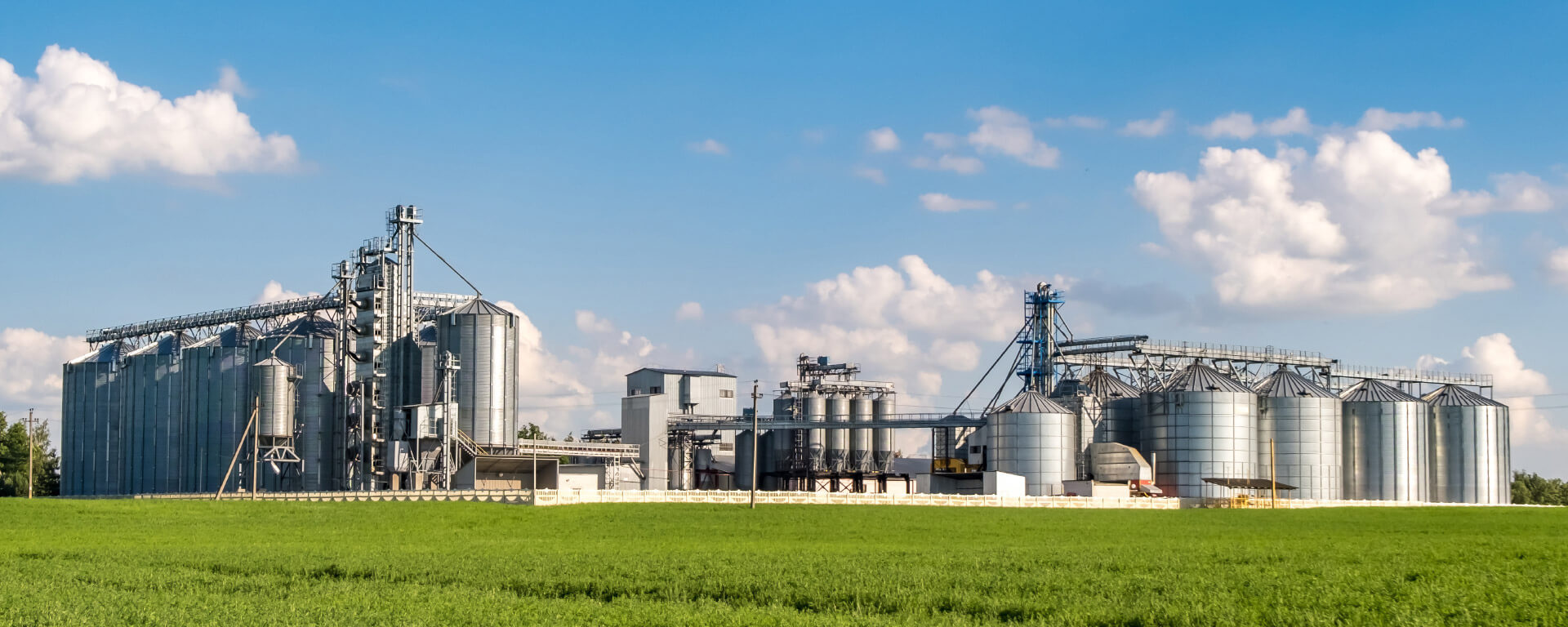 Large silo facility in the countryside in front of a blue sky